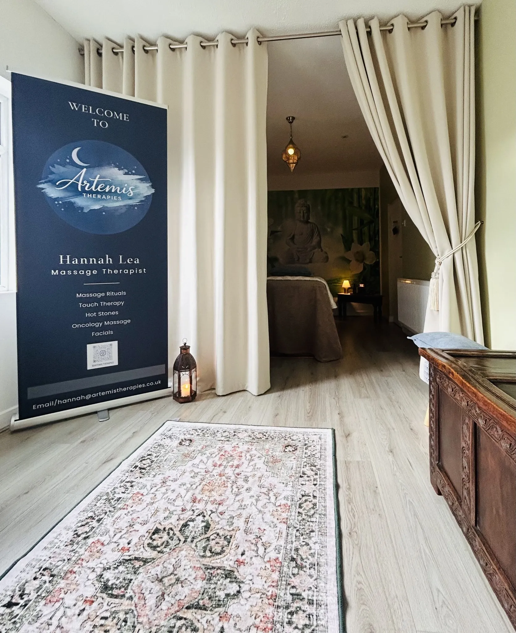 The calm, candle-lit treatment room at Artemis Therapies in Ruthin